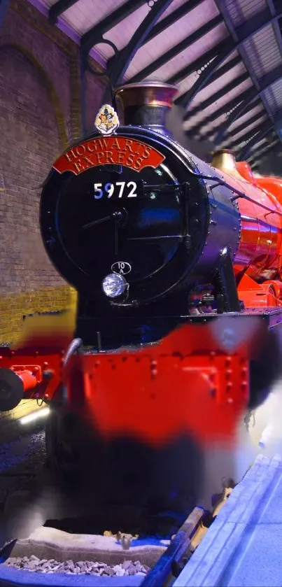 Hogwarts Express train in vibrant red at a station platform.