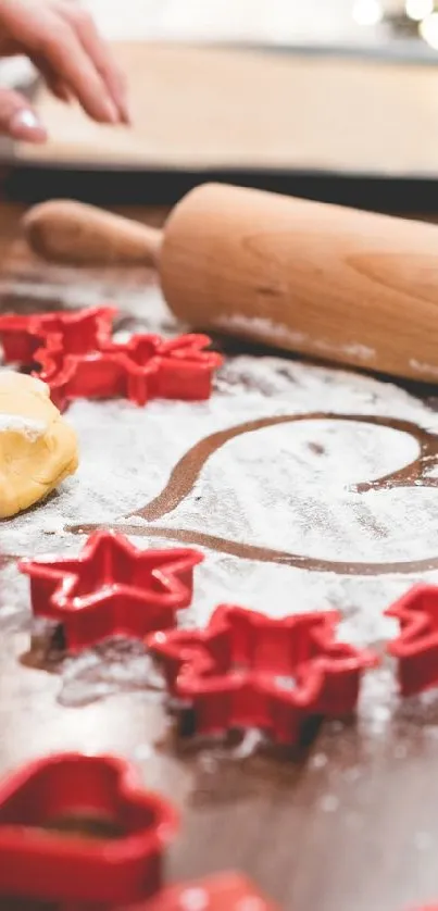 Heart-shaped cookie cutter in flour on wooden table with red accents.