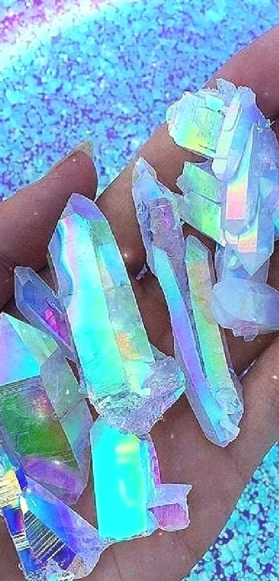 Holographic crystals resting on a hand over a vibrant blue background.