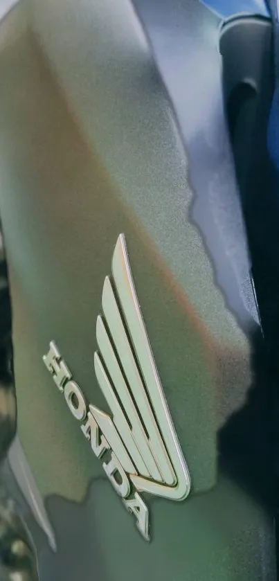 Close-up of a sleek Honda motorcycle design with a metallic finish.