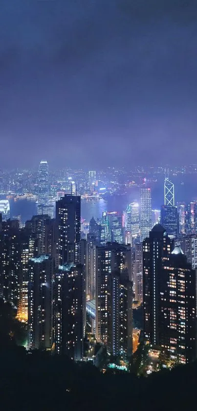 Stunning nighttime view of Hong Kong's illuminated skyline and skyscrapers.