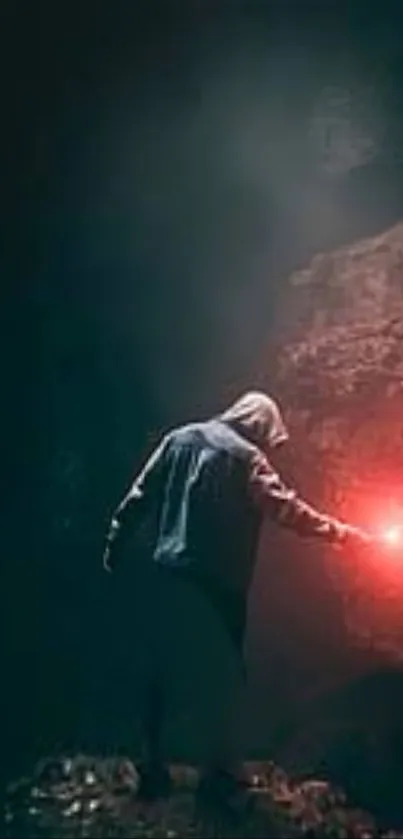 A hooded figure with a red flare in a dark cave.