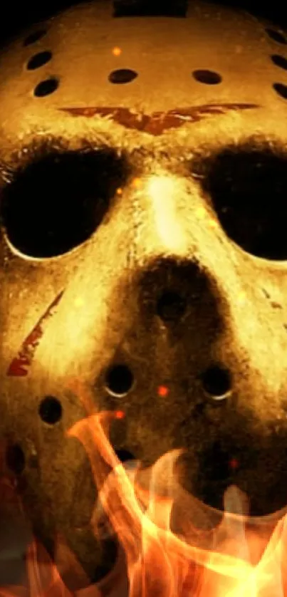 Chilling horror mask with fiery background and intense color scheme.