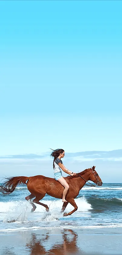 Woman riding a horse along the beach with a bright blue sky.