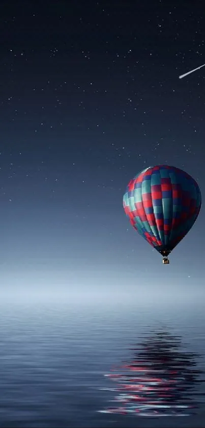 Hot air balloon floating over calm sea under a starry night sky.