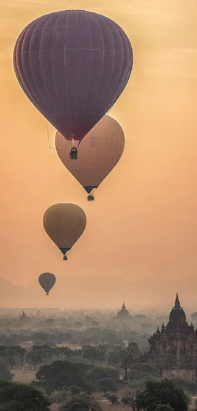 Hot air balloons float over temples at sunrise, creating a serene landscape.