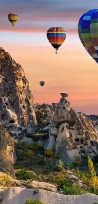 Colorful hot air balloons over Cappadocia at sunrise.