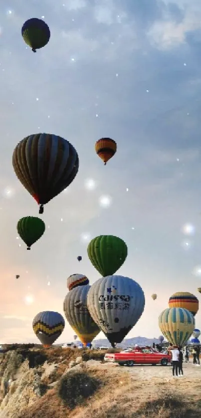 Colorful hot air balloons soaring at sunset over a scenic landscape.