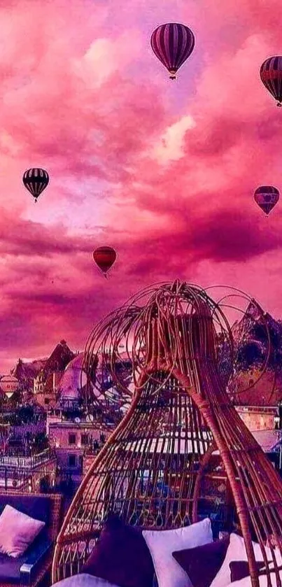 Hot air balloons float beneath a vibrant pink sunset sky.