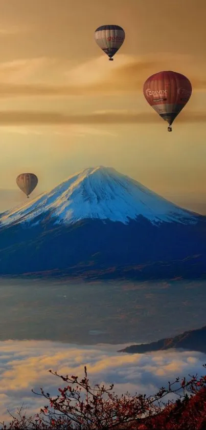 Hot air balloons float above snow-capped mountains at sunset.