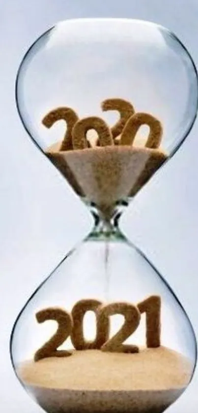 Hourglass transitioning from 2020 to 2021 made of sand.