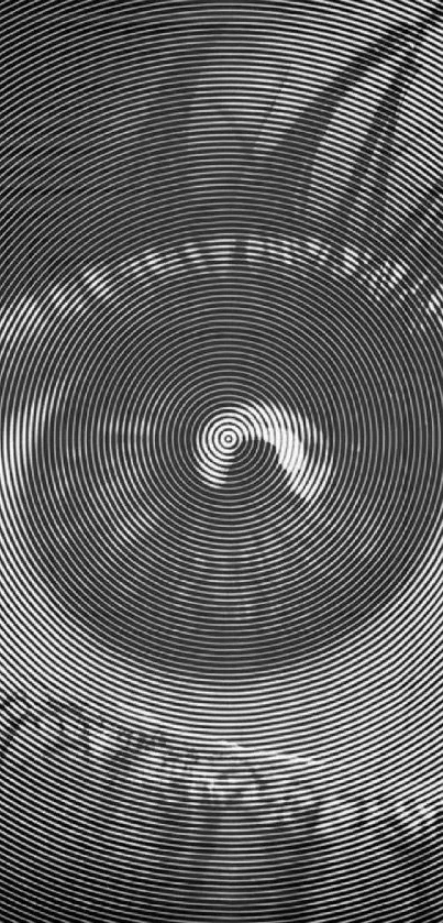 Hypnotic black and white spiral design wallpaper.