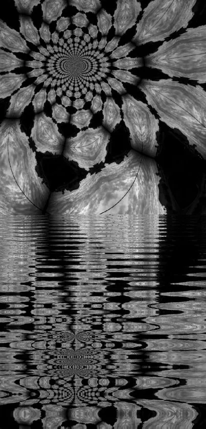 Monochrome kaleidoscope art reflecting on water surface.