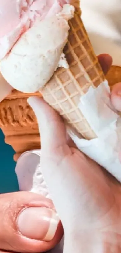 Close-up of hands holding ice cream cones.