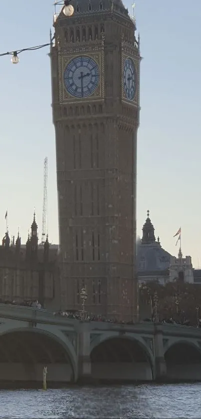 Big Ben and Thames River with a blue sky backdrop.