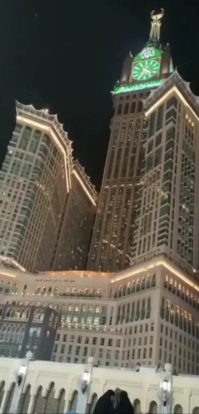 Illuminated iconic clock tower at night with glowing architectural beauty.