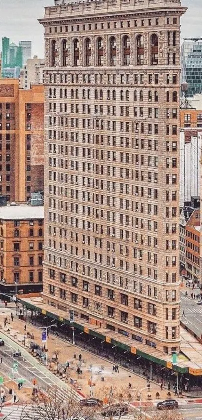 Flatiron Building in New York City with urban backdrop.