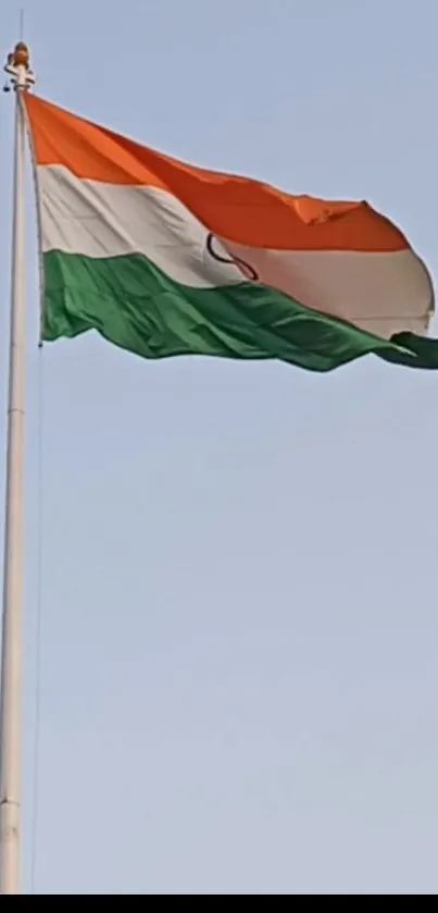 Indian national flag waving in the sky, perfect for phone wallpaper.