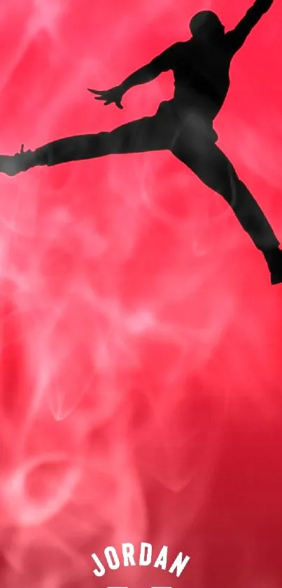 Silhouette of jumping figure on red wallpaper.