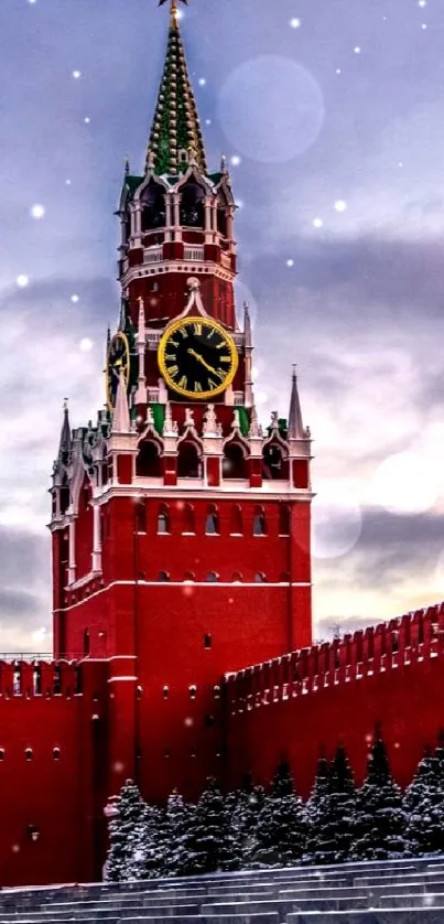 Spasskaya Tower of the Kremlin in winter with snowy landscape.