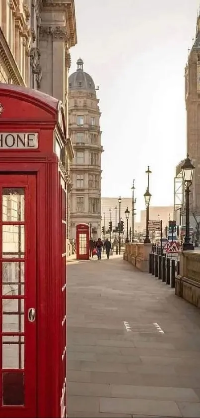 Red London phone booth with Big Ben in background.