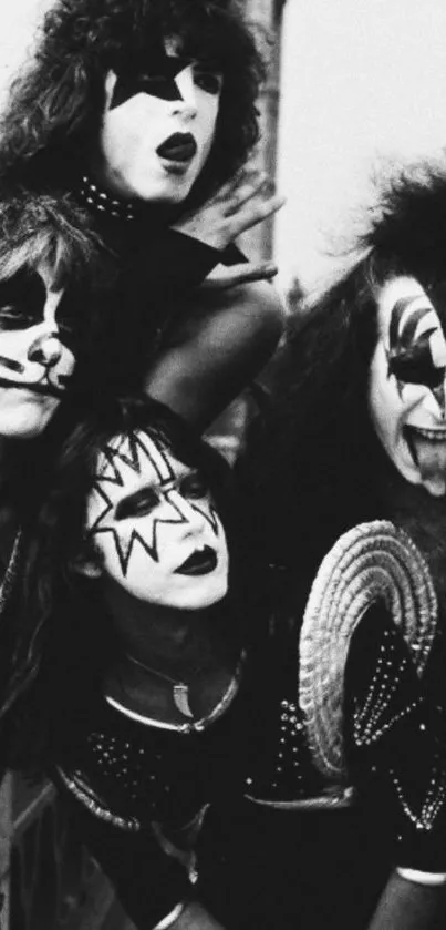 Black and white wallpaper of an iconic rock band in striking outfits.