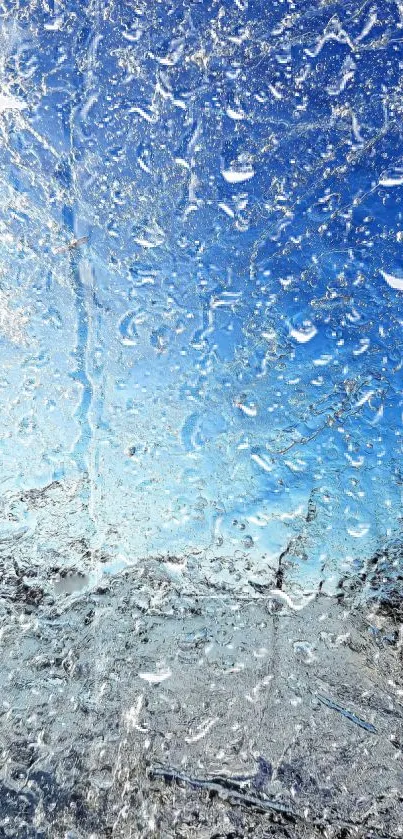 Icy blue wallpaper with raindrops on glass.