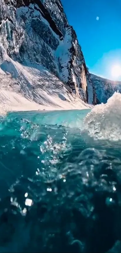 Stunning icy mountain lake with bright blue waves under a clear sky.