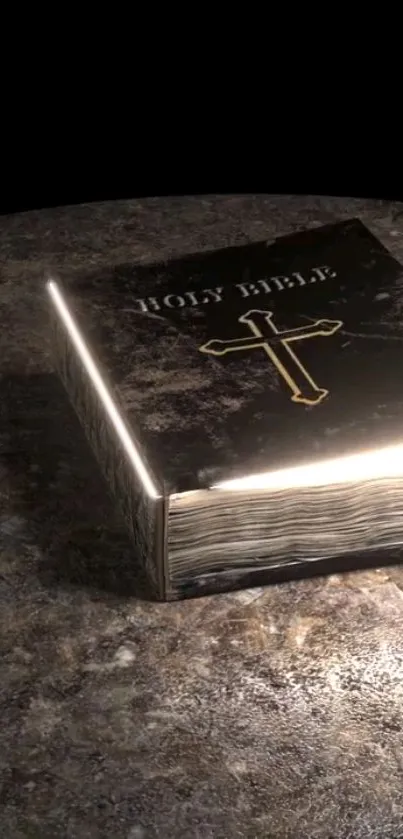 Illuminated Bible resting on a stone surface, dark-themed mobile wallpaper.