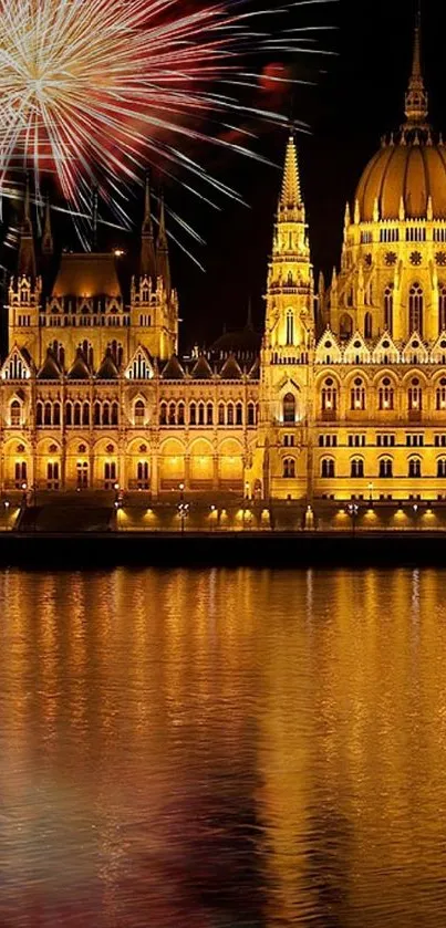 Illuminated building with fireworks reflecting on water at night.