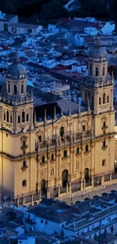 Illuminated cathedral with cityscape at night.