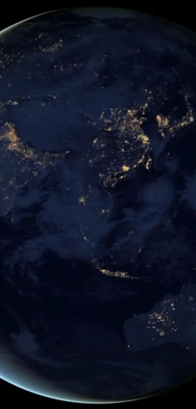 Earth from space at night with glowing city lights and dark blue oceans.