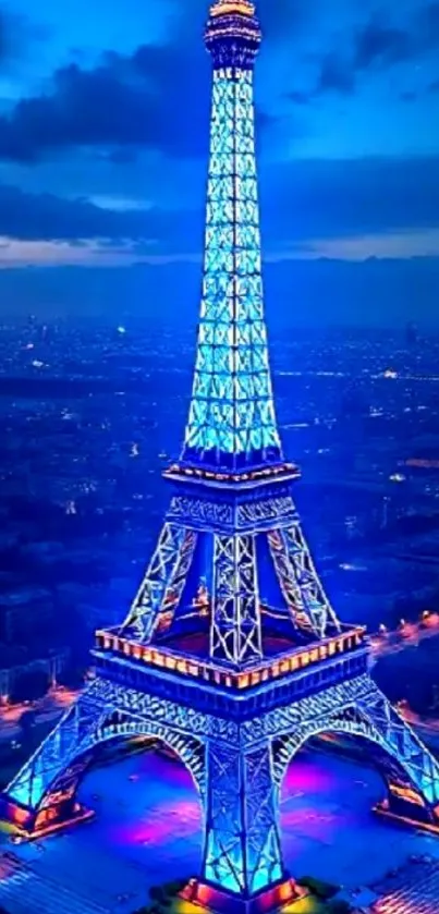 Eiffel Tower illuminated in blue at night.