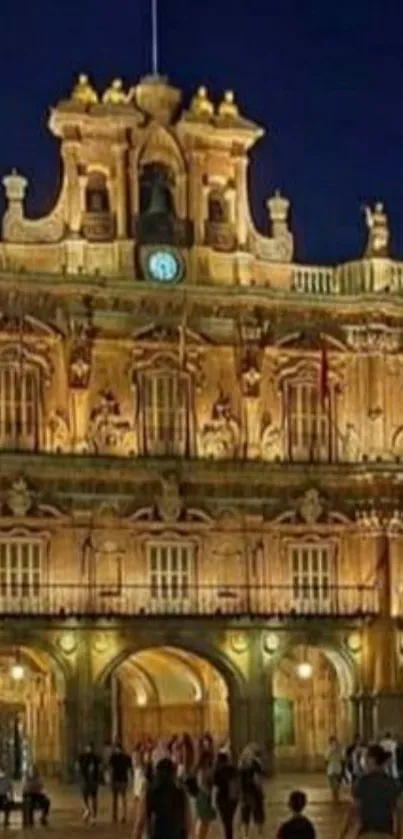 Night view of an illuminated historic plaza.