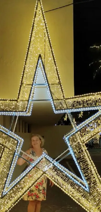 Glowing star-shaped decoration in a night scene with palm trees.