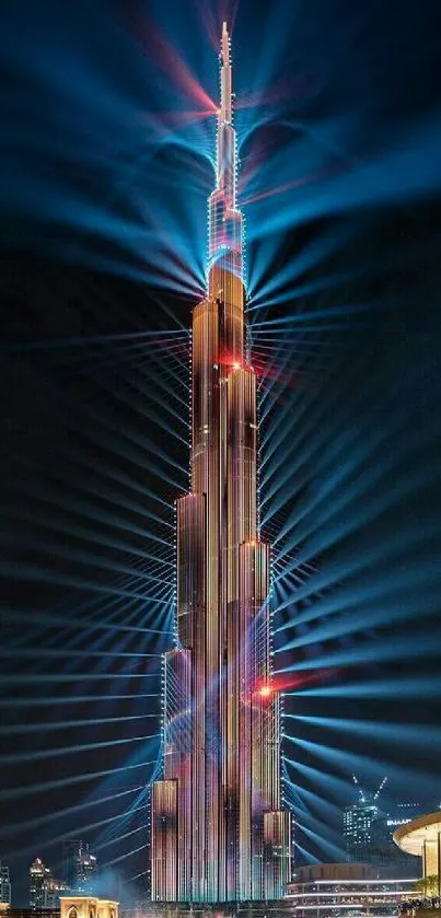 Illuminated tower with laser lights at night.