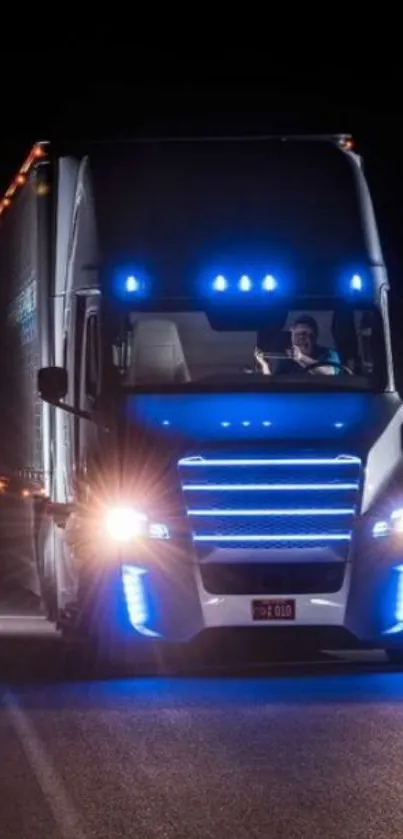 Modern truck with blue lights on dark road at night.