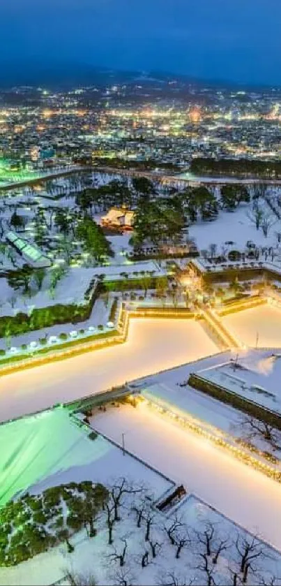 Aerial view of illuminated snowy fortress cityscape at night.