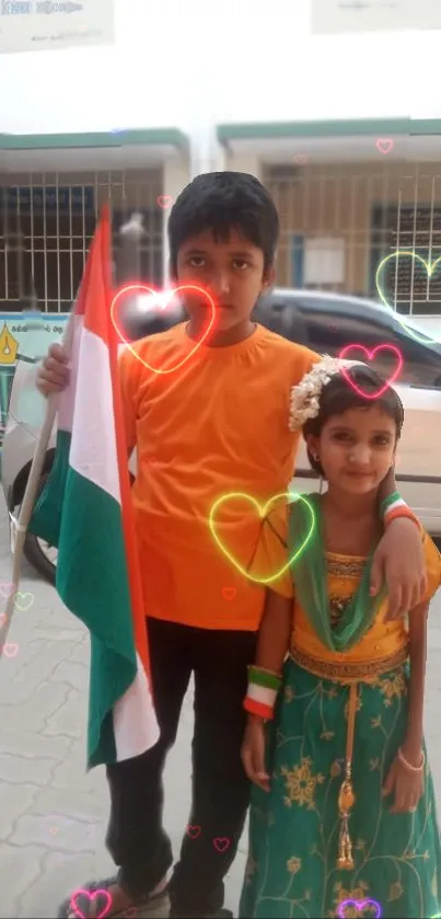 Children celebrating with Indian flag and colorful hearts in festive attire.