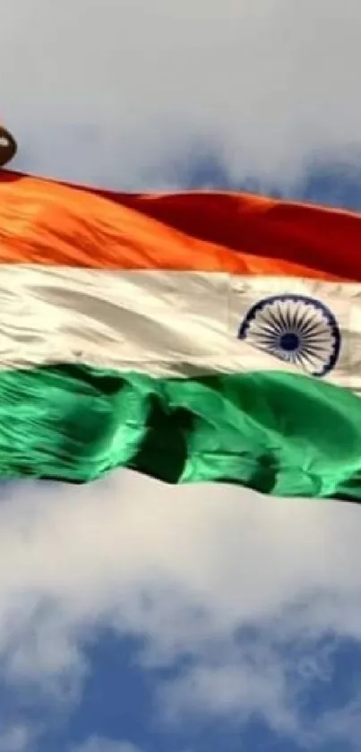 Indian flag waving against a clear blue sky.