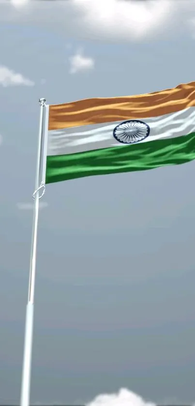 Indian flag fluttering in blue sky background.