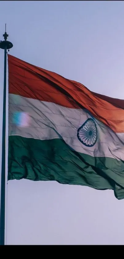 Waving Indian flag against the sky in vibrant colors.