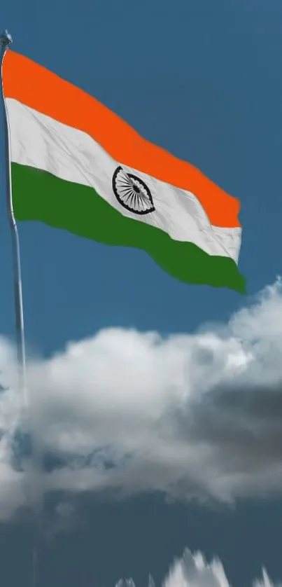 Indian flag fluttering in a cloudy sky.