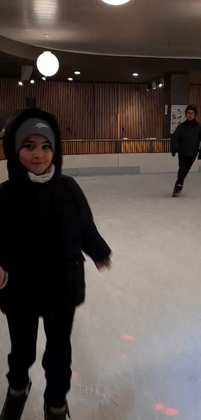 Children enjoying indoor ice skating rink.