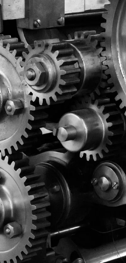 Close-up of metallic gears in an industrial setting, showcasing mechanical precision.