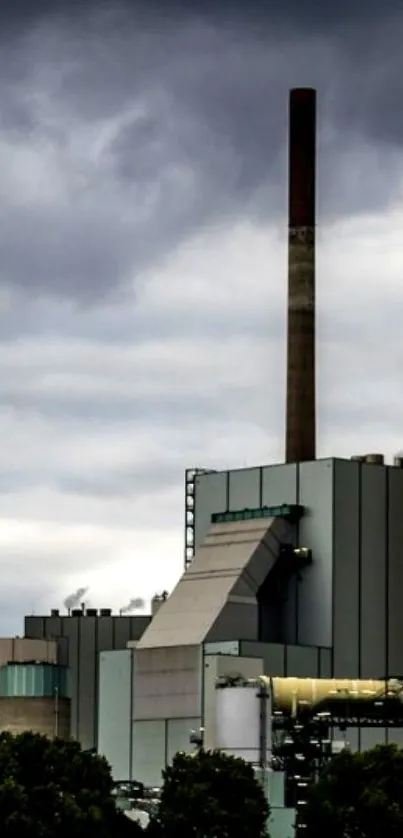 Tall industrial chimney under a cloudy sky.