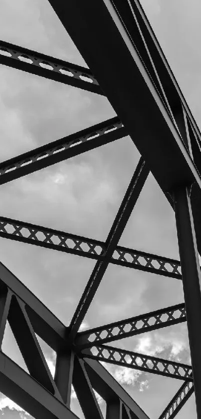 Industrial steel frame against a cloudy sky, capturing architectural beauty.