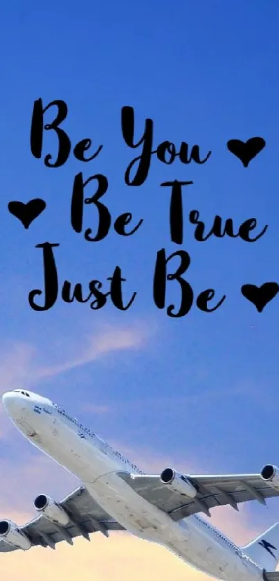 Airplane with inspirational words flying in a blue sky.