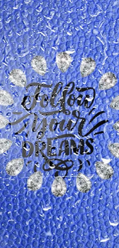 Blue textured wallpaper with 'Follow Your Dreams' quote in center.