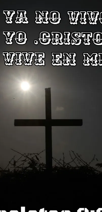 Silhouette of a cross with Bible verse in Spanish and heart icon.